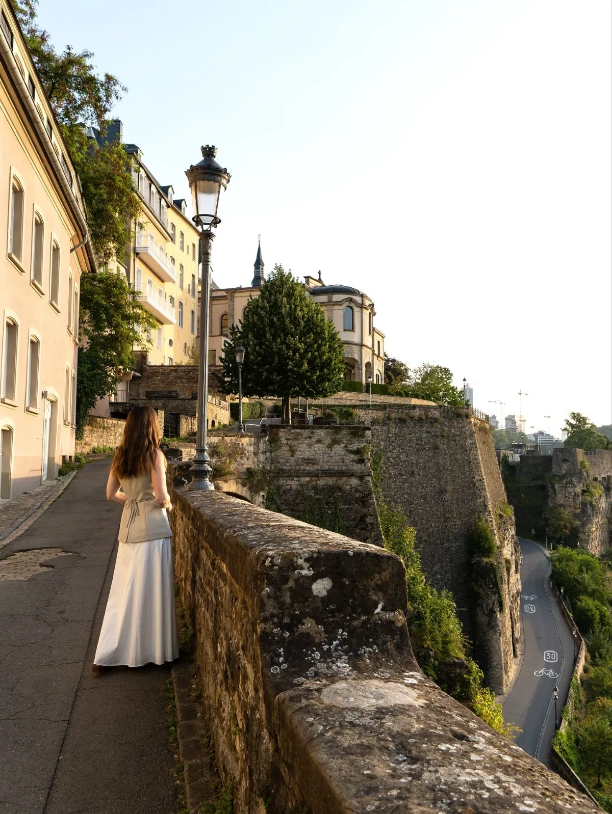 Families walking on the Chemin de la Corniche overlooking the Alzette river