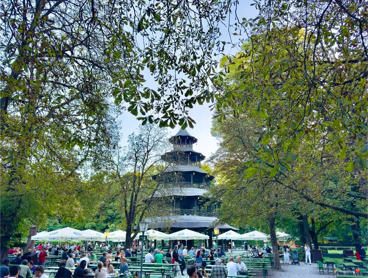 The Chinese Tower beer garden in Munich Englischer Garten with people socializing