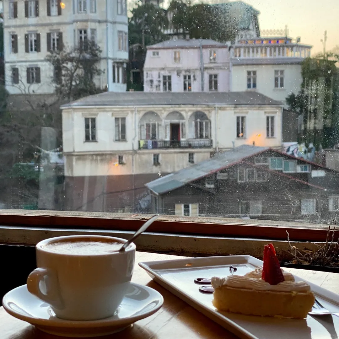 Outdoor cafe seating in Pasaje Galvez Valparaiso during golden hour
