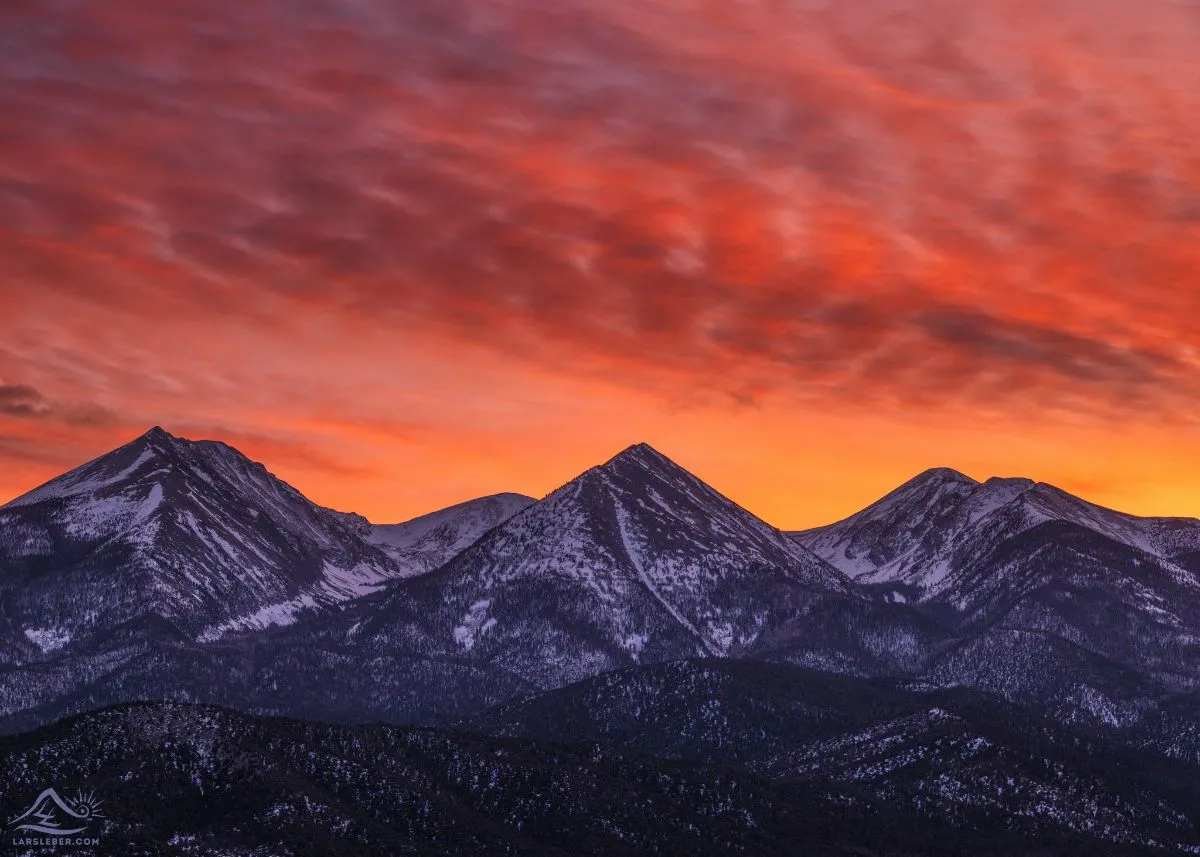 Sunset illuminating the Sangre de Cristo Mountains behind the town of Crestone Colorado