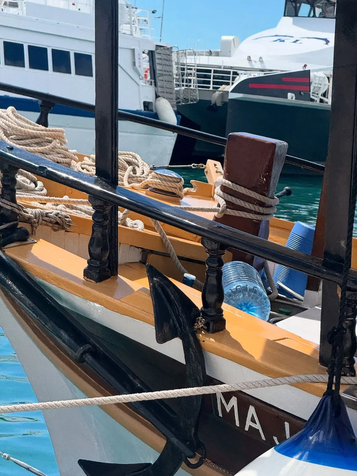 A fast Jadrolinija catamaran speeding across the blue Croatian sea.