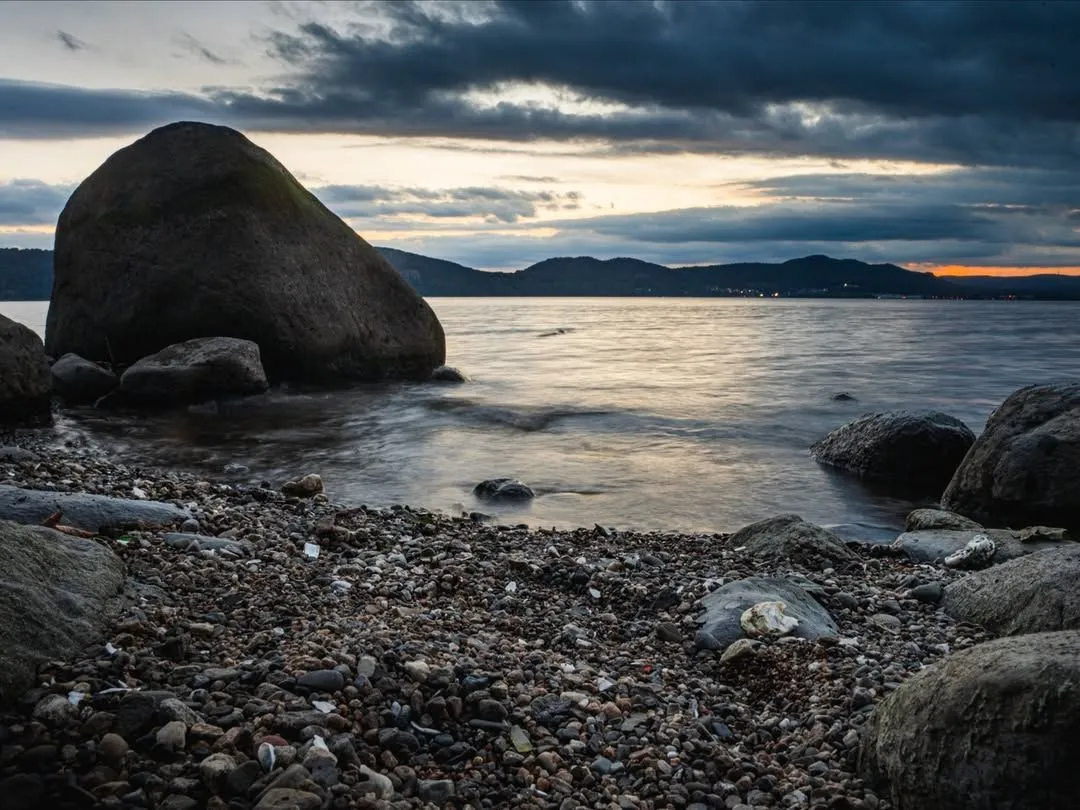 Aerial view of the green peninsula at Croton Point Park extending into the Hudson River