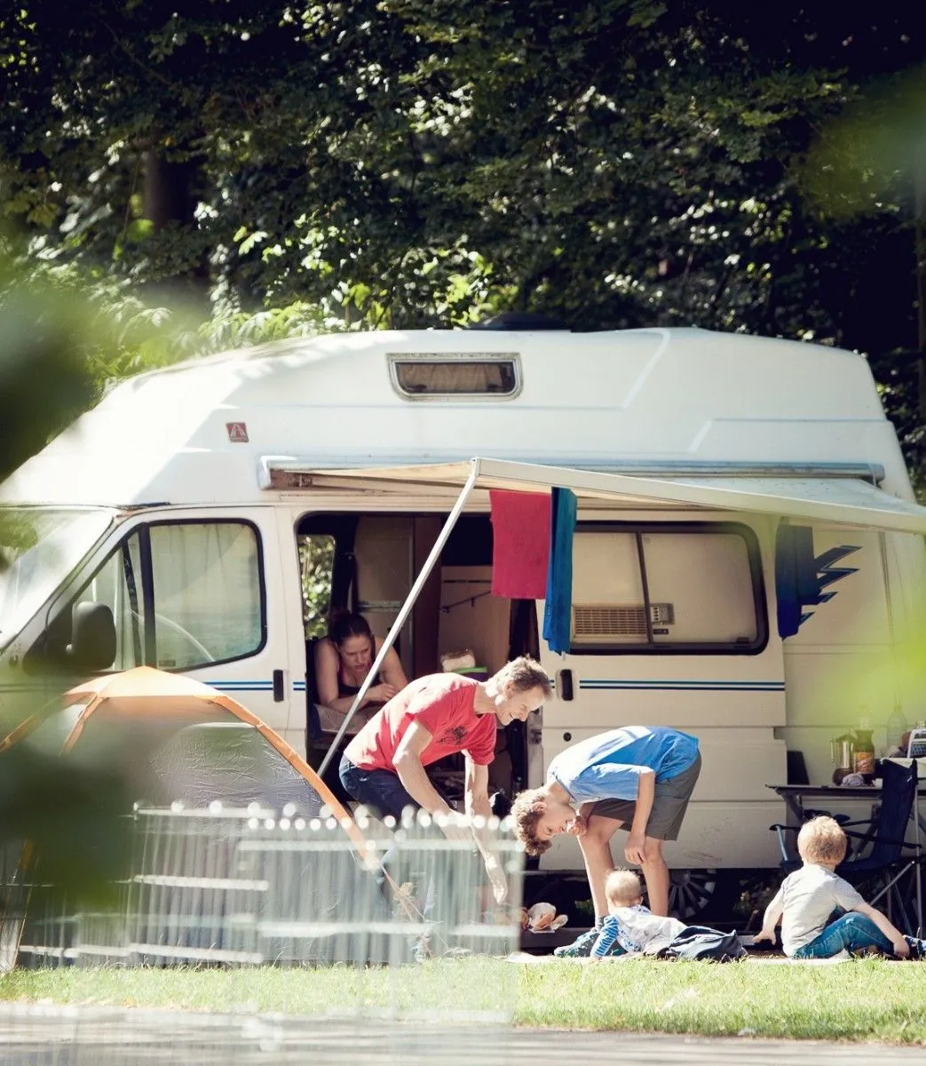 Picnic lunch with bread and cheese on a hiking trail bench
