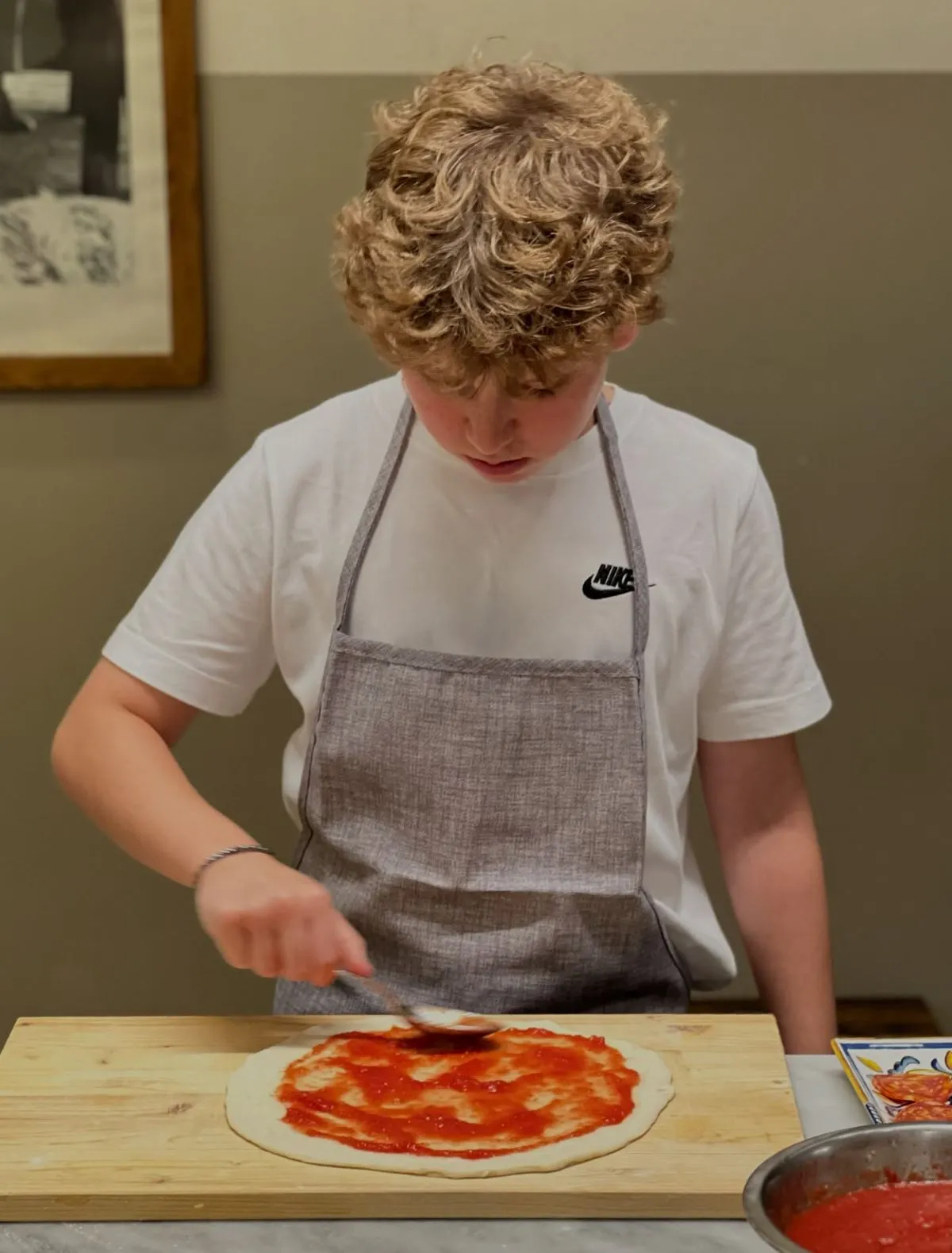 Hands kneading gluten free dough during a cooking class in Rome