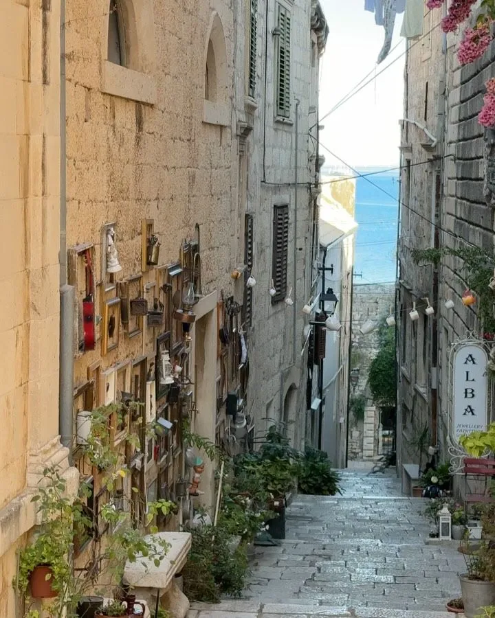 Narrow stone alleyway in a historic Croatian island town