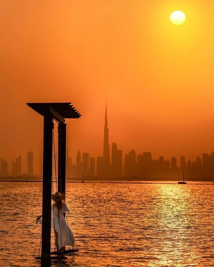 The man-made lakes and skyscrapers of Jumeirah Lake Towers in Dubai at sunset.