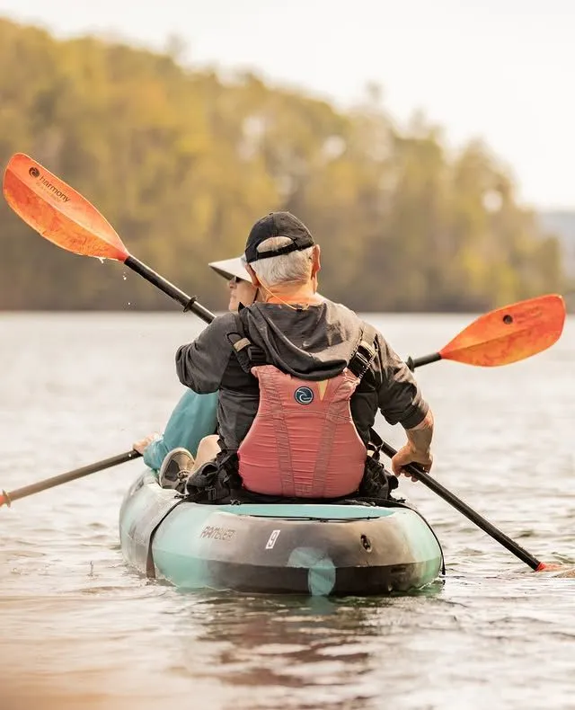 Close up of a yellow kayak paddle entering the water during a sunny day on the Hudson River
