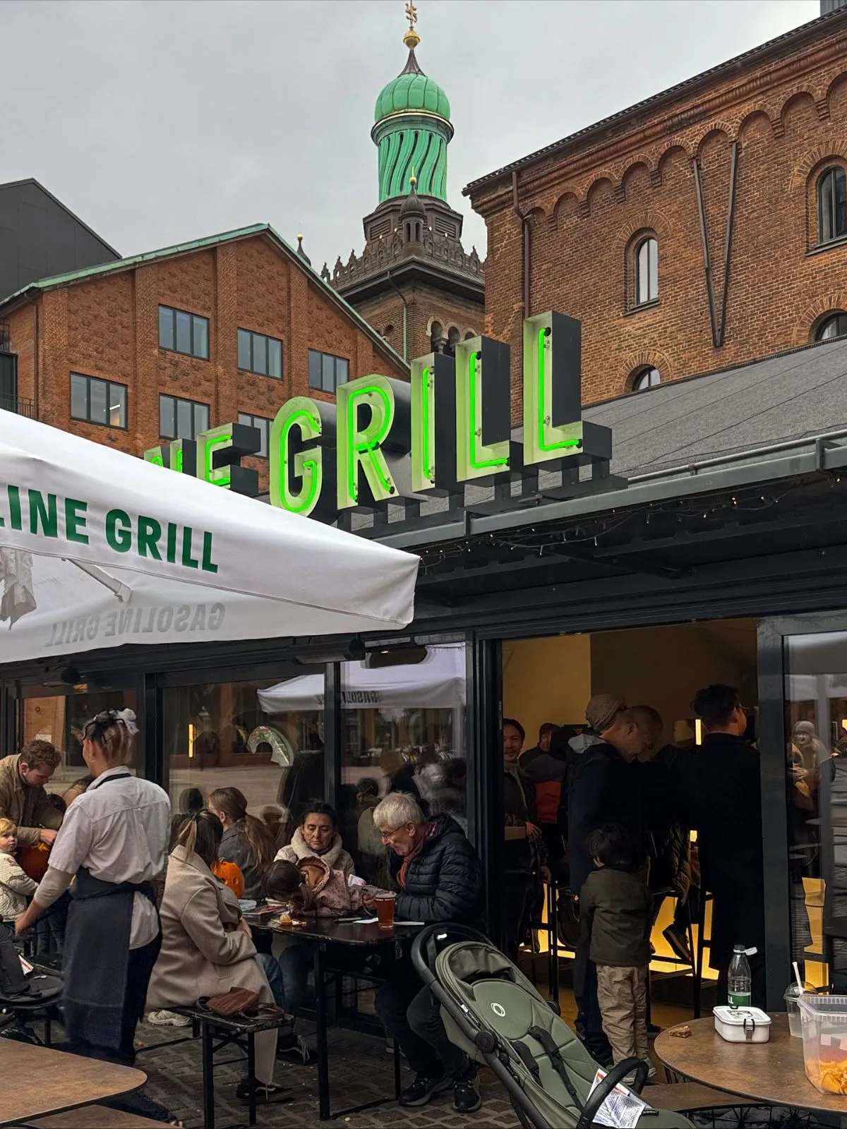 Students and locals waiting in line for burgers at the retro Gasoline Grill station