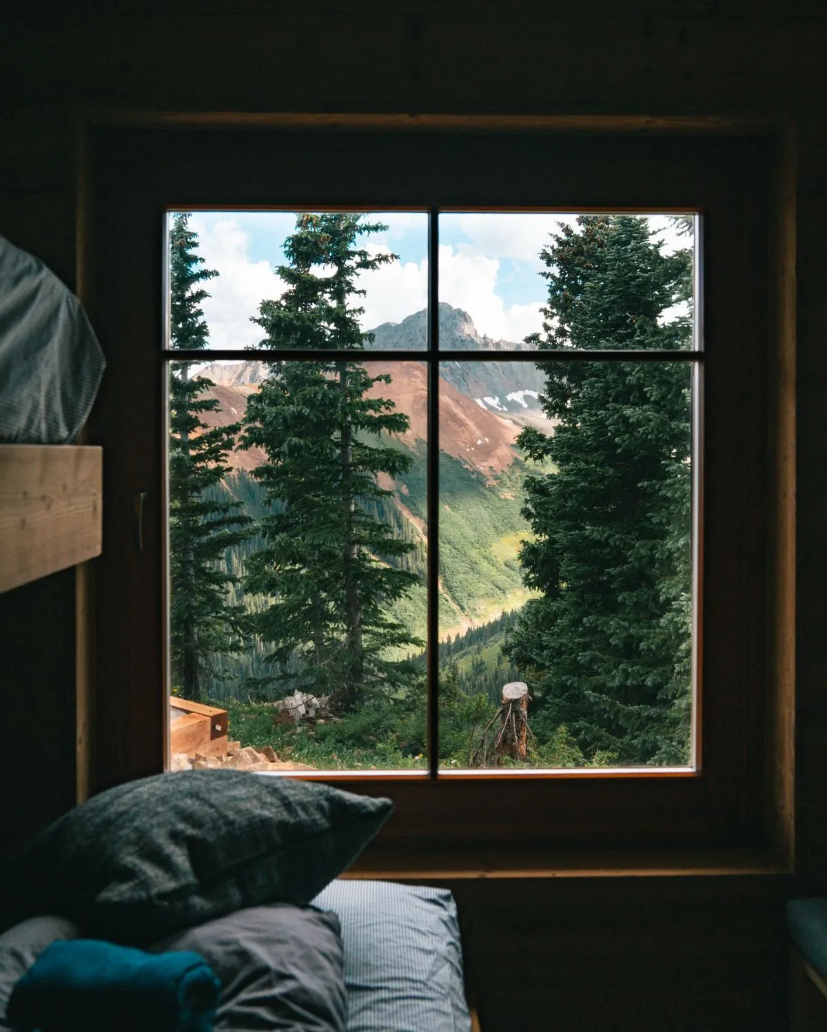 Hikers resting at a traditional Italian mountain hut in the Alps