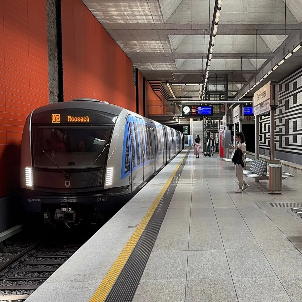 Modern and clean Munich U-Bahn station platform with orange accents