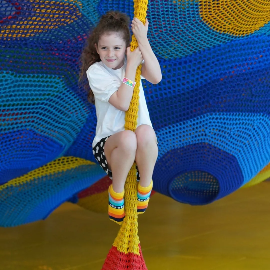 Interior of OliOli Dubai showing spacious play areas and wooden architecture