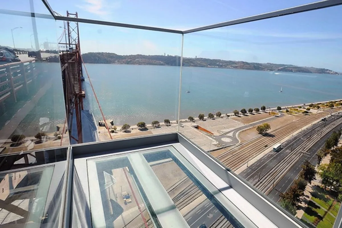 Looking down through the glass floor of the Pilar 7 Bridge Experience in Lisbon