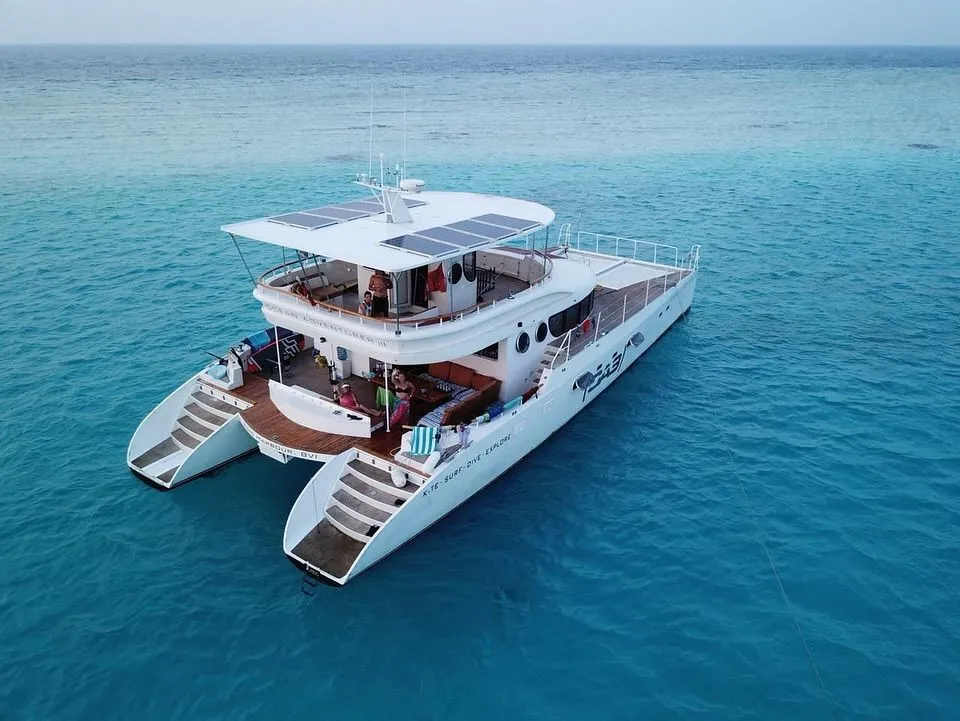 Luxury catamaran sailing near a sandbank in the Zanzibar Archipelago