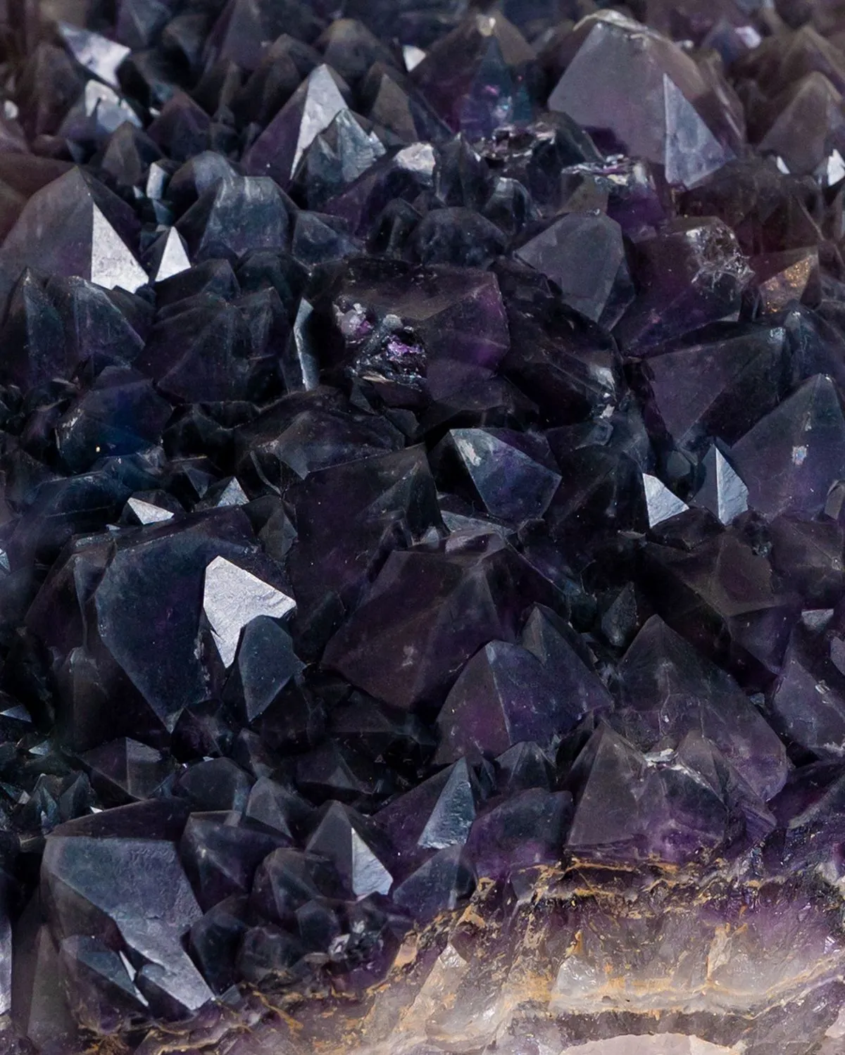 Close up of purple amethyst crystals in a glass case at the Musee de Mineralogie in Strasbourg France
