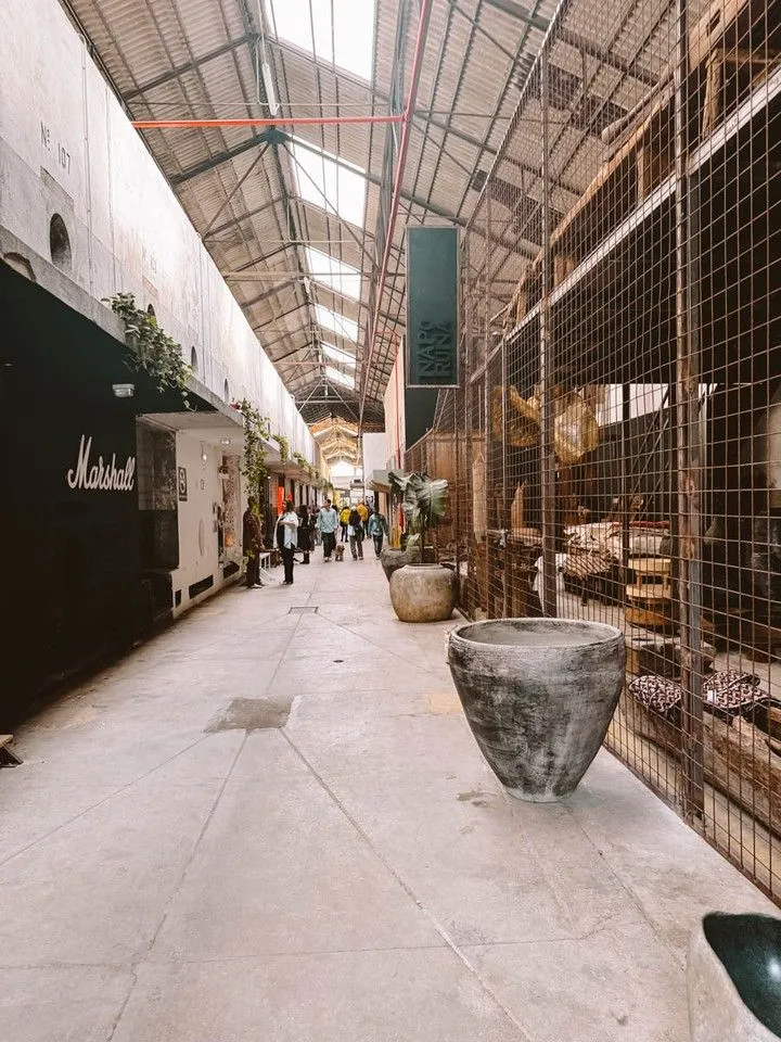Family walking past painted warehouses in Marvila district