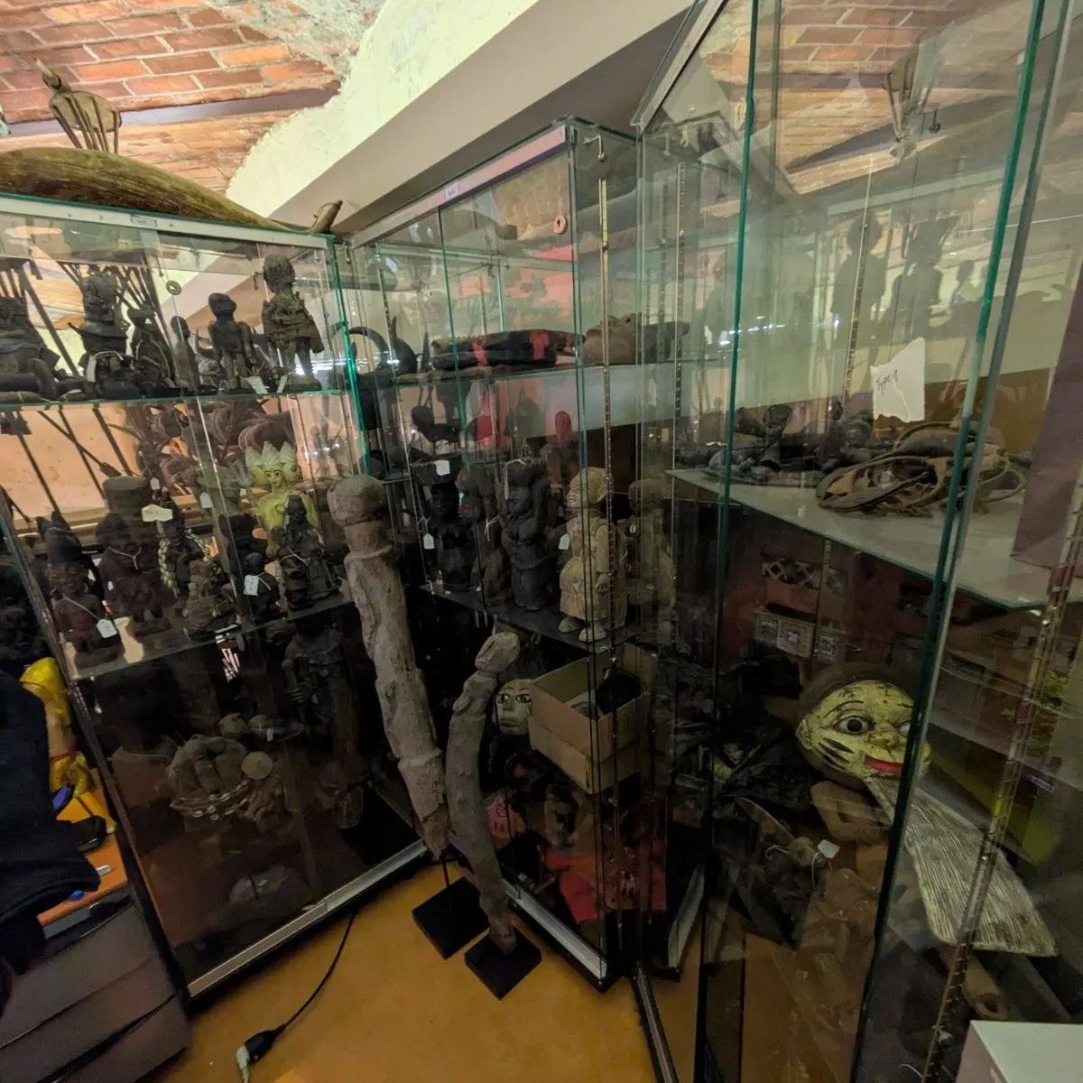 Intricately carved West African ritual statues inside the Vodou museum