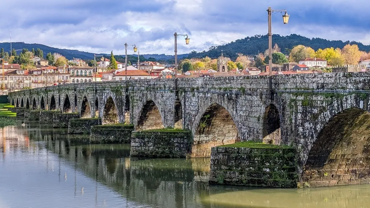 A historical Roman and medieval bridge spanning the Lima River in Portugal