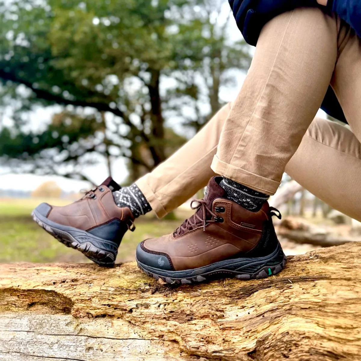 Hiking boots gripping rocky granite surface on a steep trail