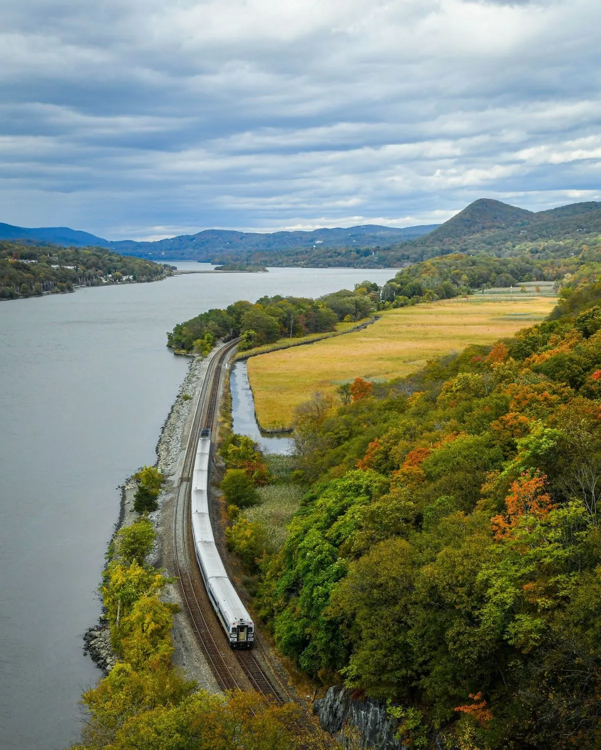 Metro North train traveling along the Hudson River towards hiking trails
