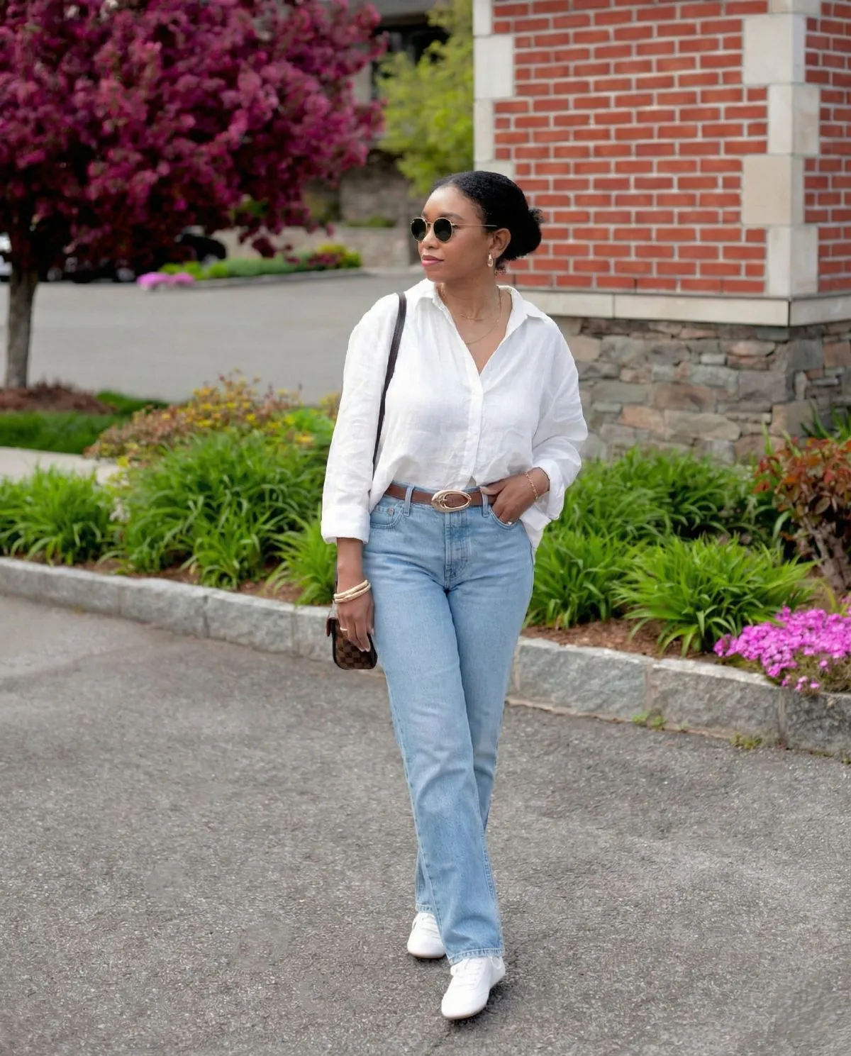 Elegant Parisian summer outfit featuring white linen shirt and vintage denim
