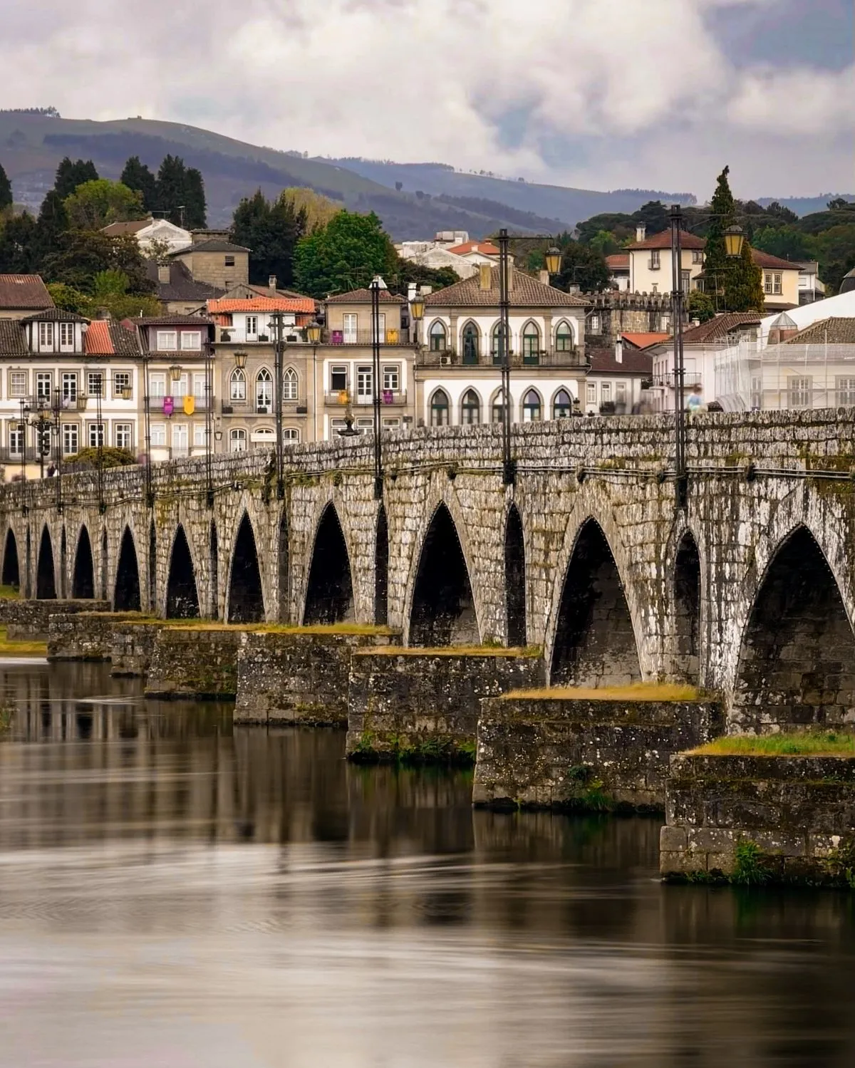Close-up of the ancient stone arches of the bridge in Ponte de Lima