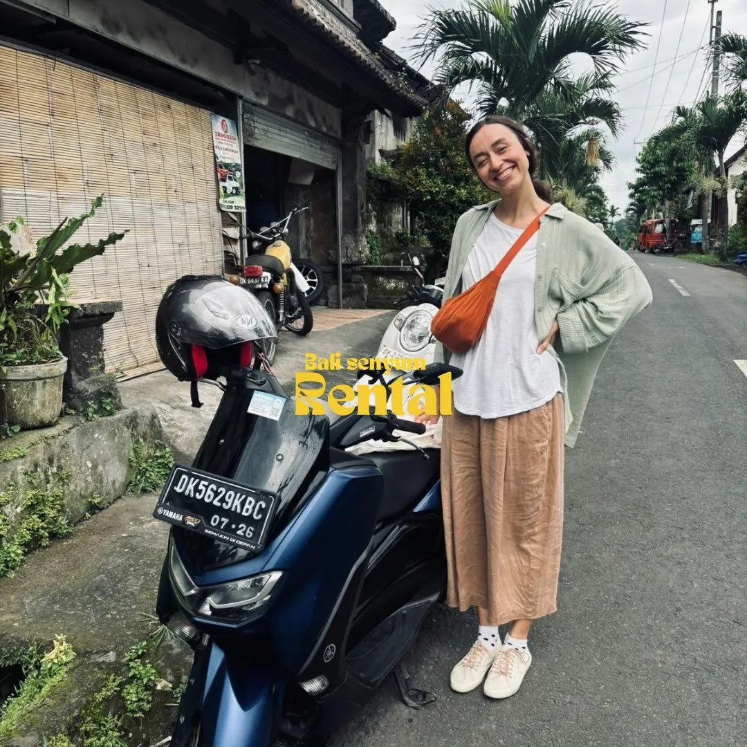 Modern black scooter parked outside a boutique villa in Pererenan Bali