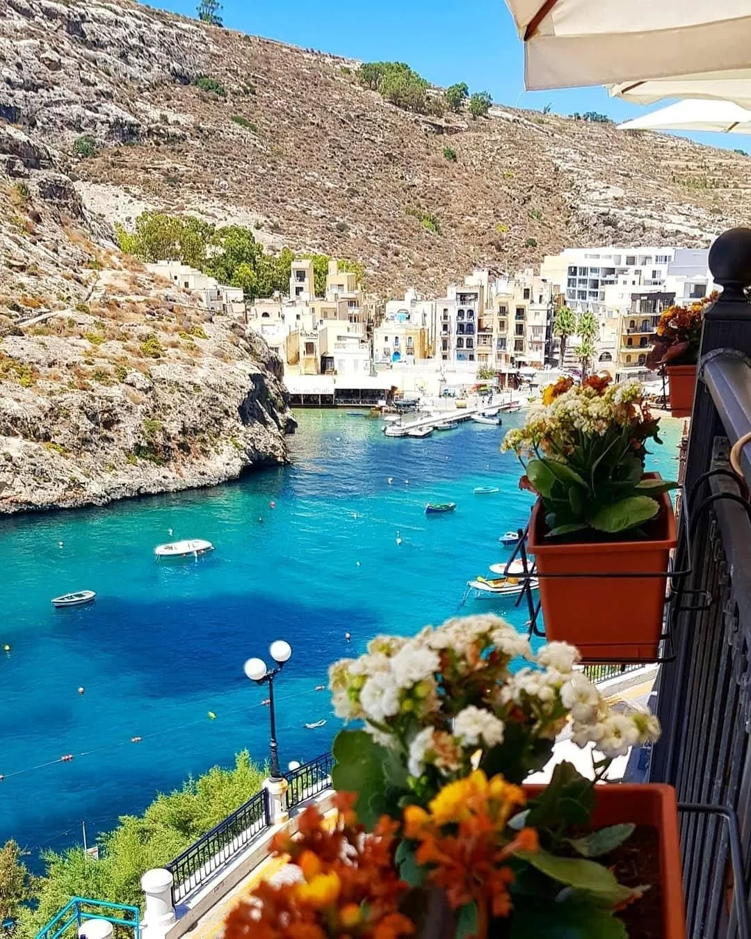 A charming coastal village of Xlendi in Gozo viewed from the cliffs.