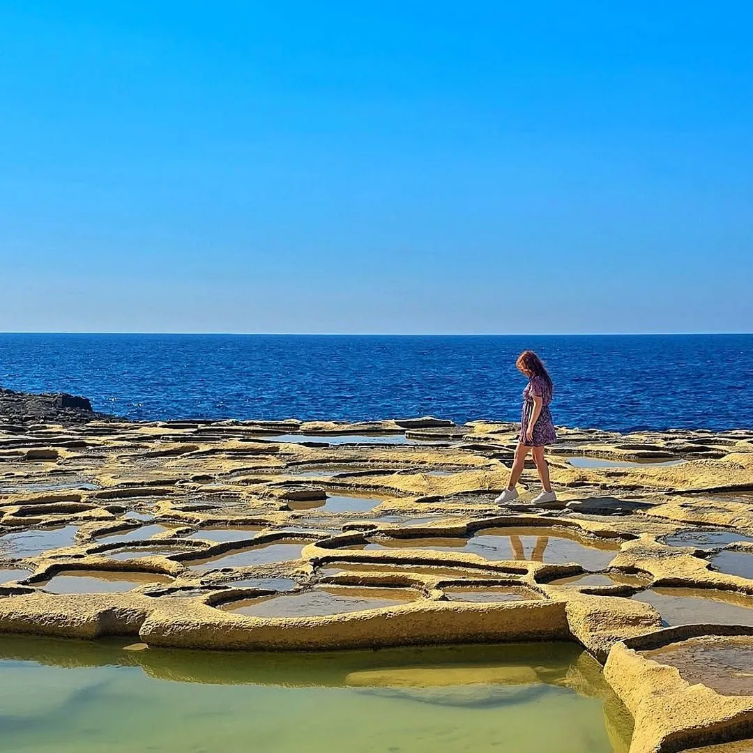 Geometric salt pans carved into the limestone coast at Xwejni Gozo