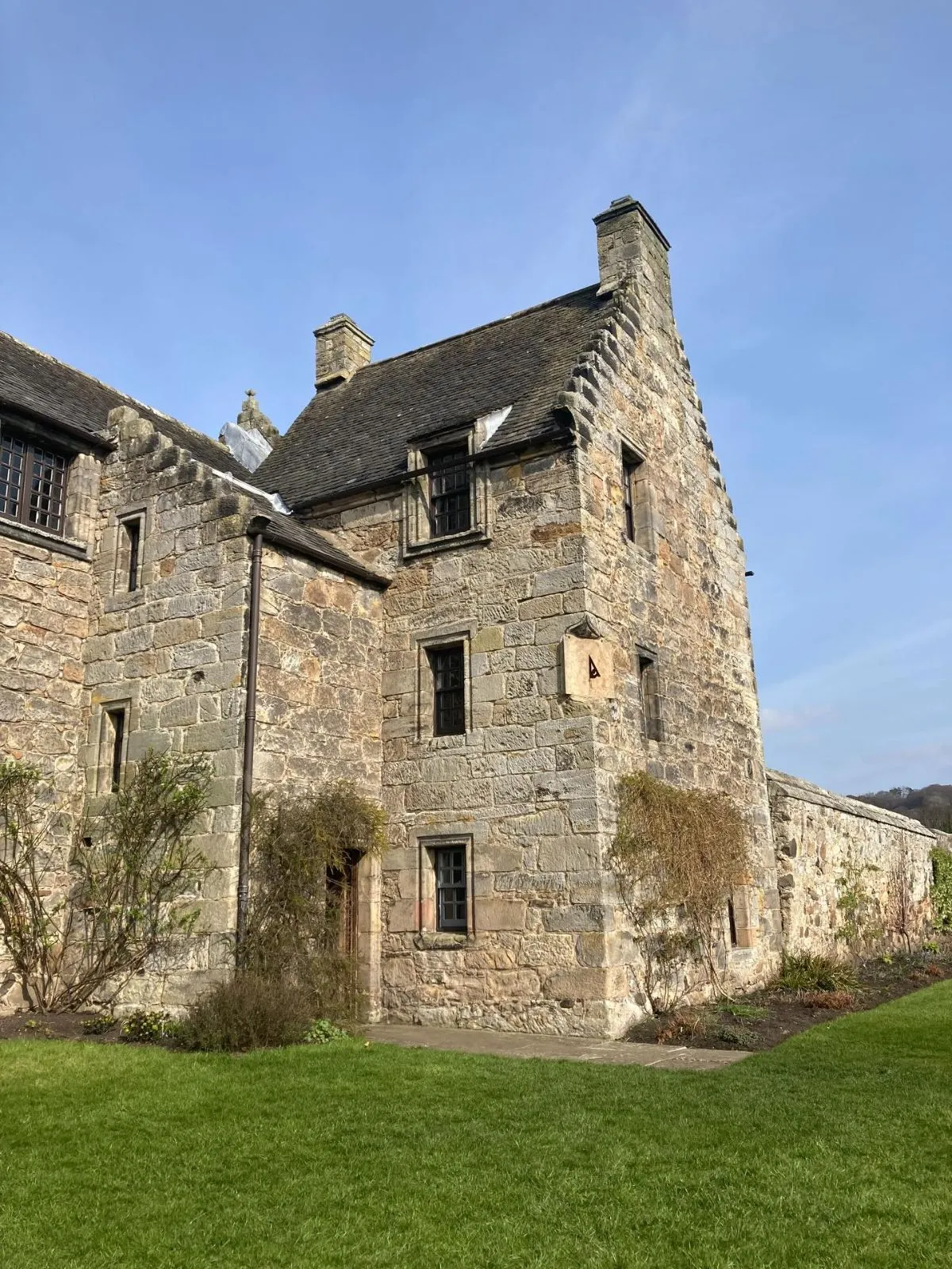 Lush terraced gardens surrounding the stone ruins of Aberdour Castle in Fife