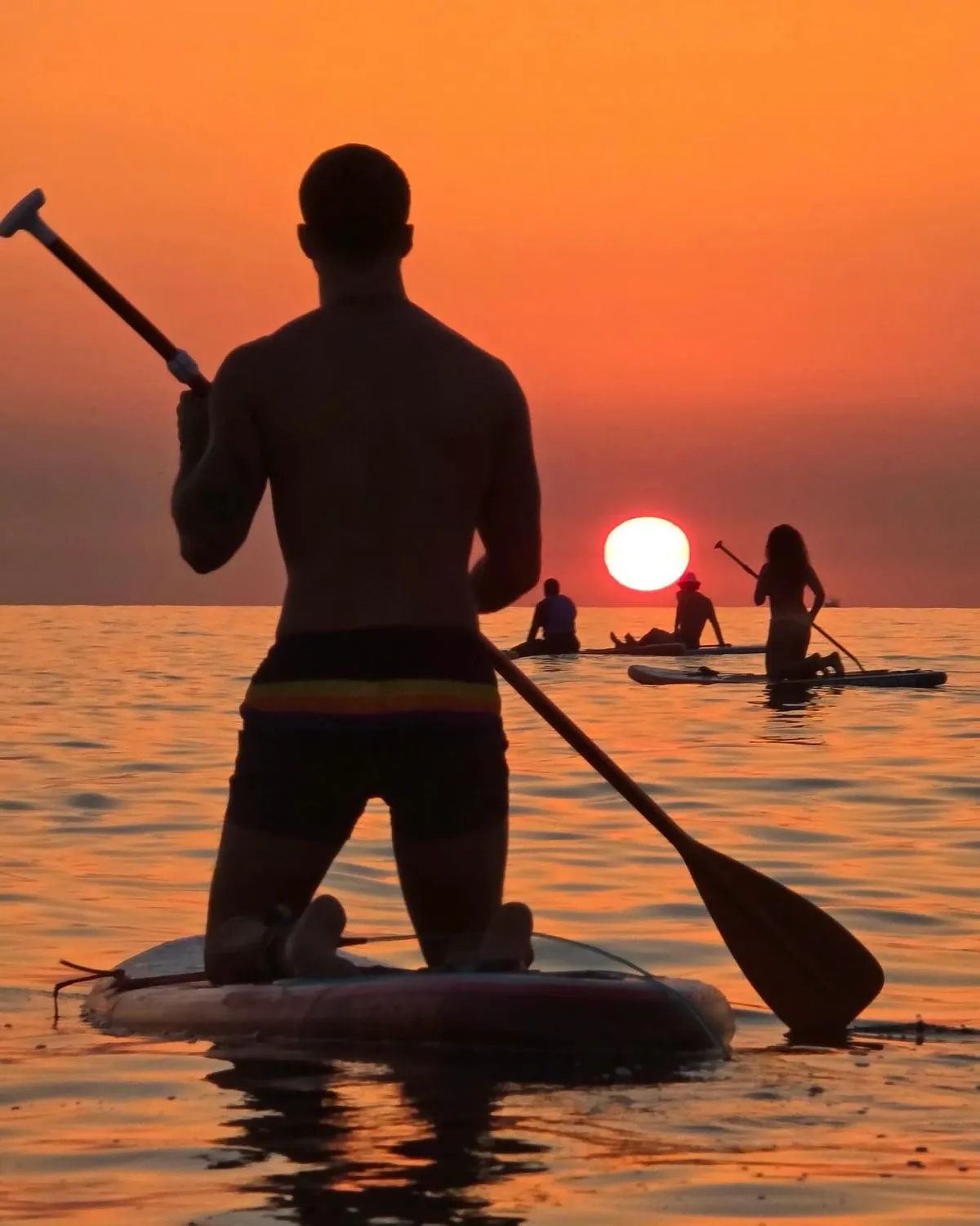 Stand up paddleboarding through the pristine waters of the Urdaibai Biosphere Reserve in Basque Country