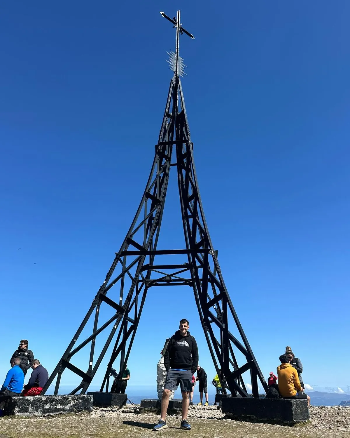 The iconic iron cross at the summit of Mount Gorbea