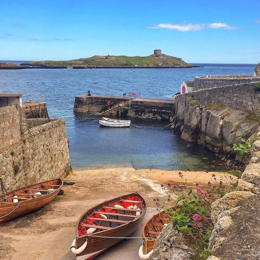 Small boat heading towards Dalkey Island and its historic Martello tower