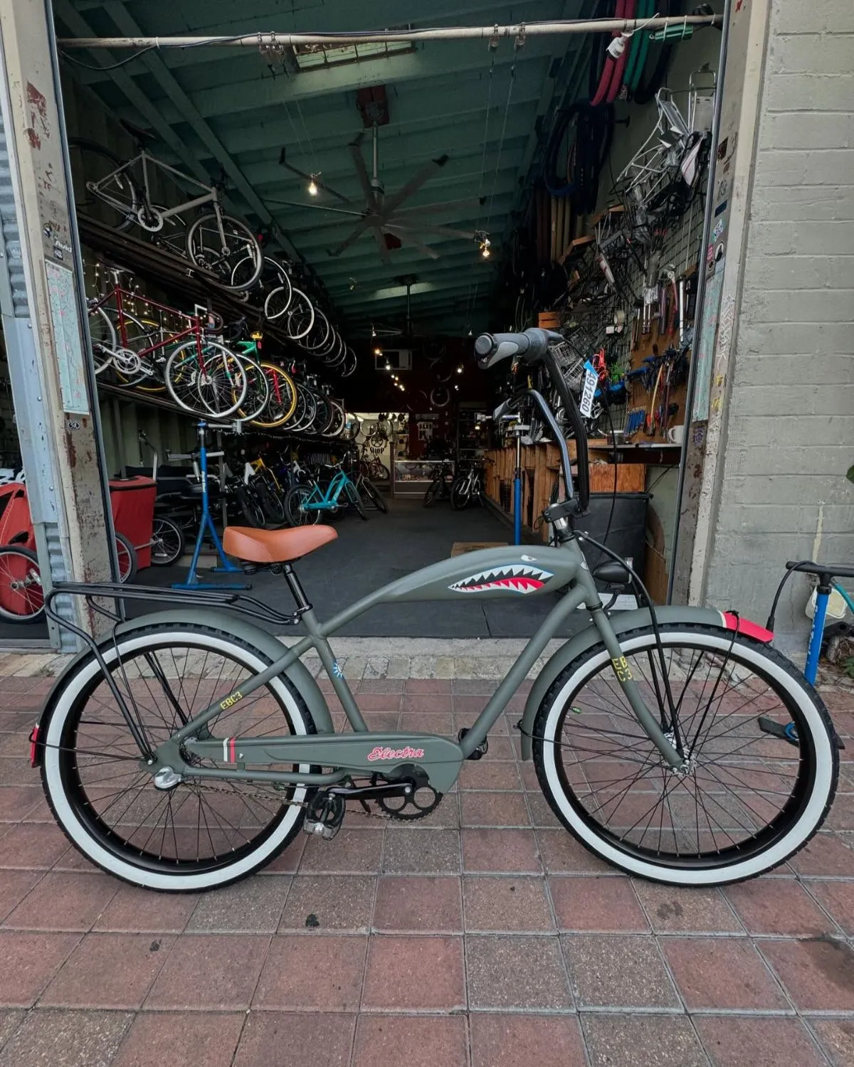 Traveler riding an e-bike along the beautiful coast of Paros island