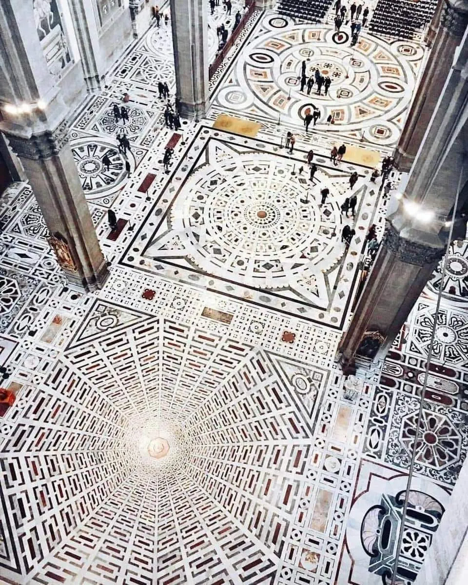 Close-up of the geometric marble mosaic floors inside the Duomo in Florence