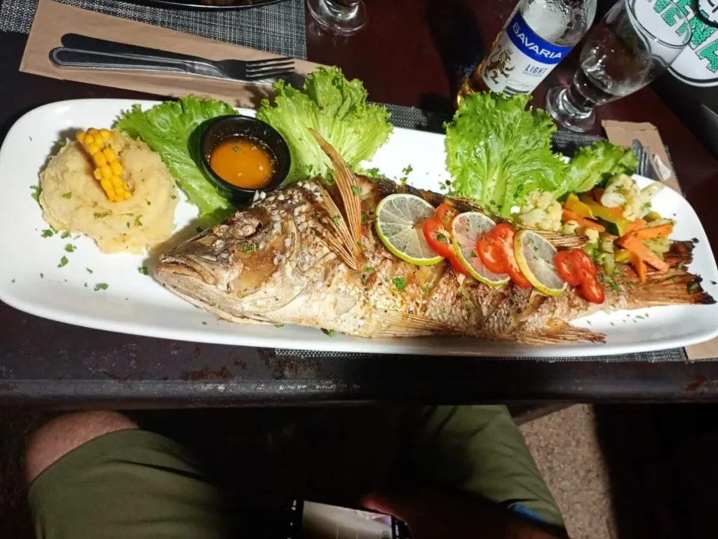 Freshly grilled fish served at a beachside palapa in Playa San Agustin