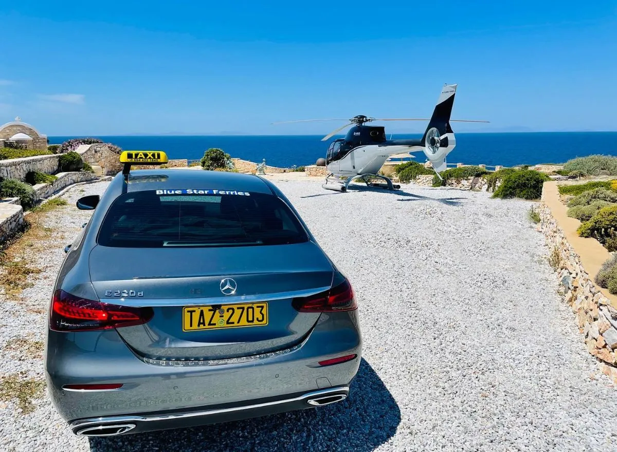 Local silver taxi waiting at the Parikia ferry port in Paros