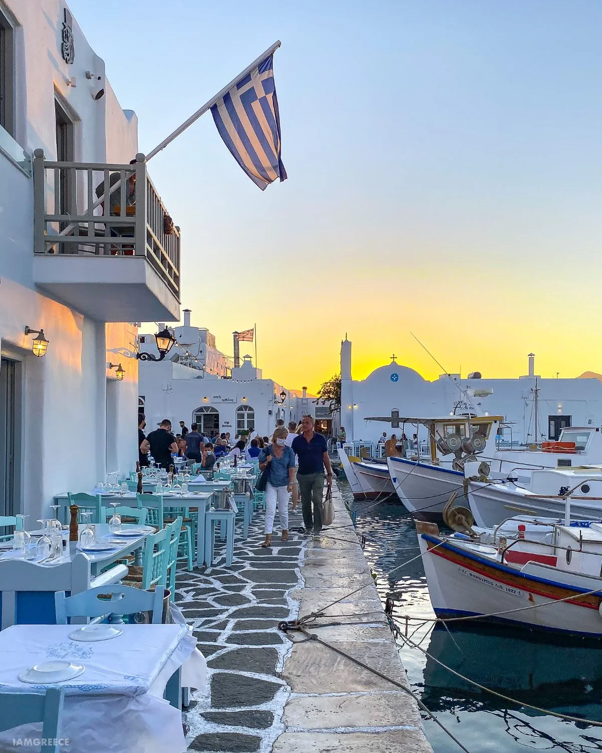Passengers boarding a water taxi at Naoussa harbor in Paros