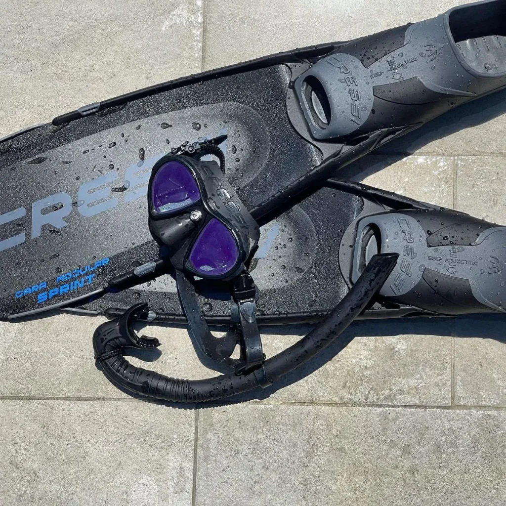 Snorkeling equipment resting on the beach at Playa Estacahuite