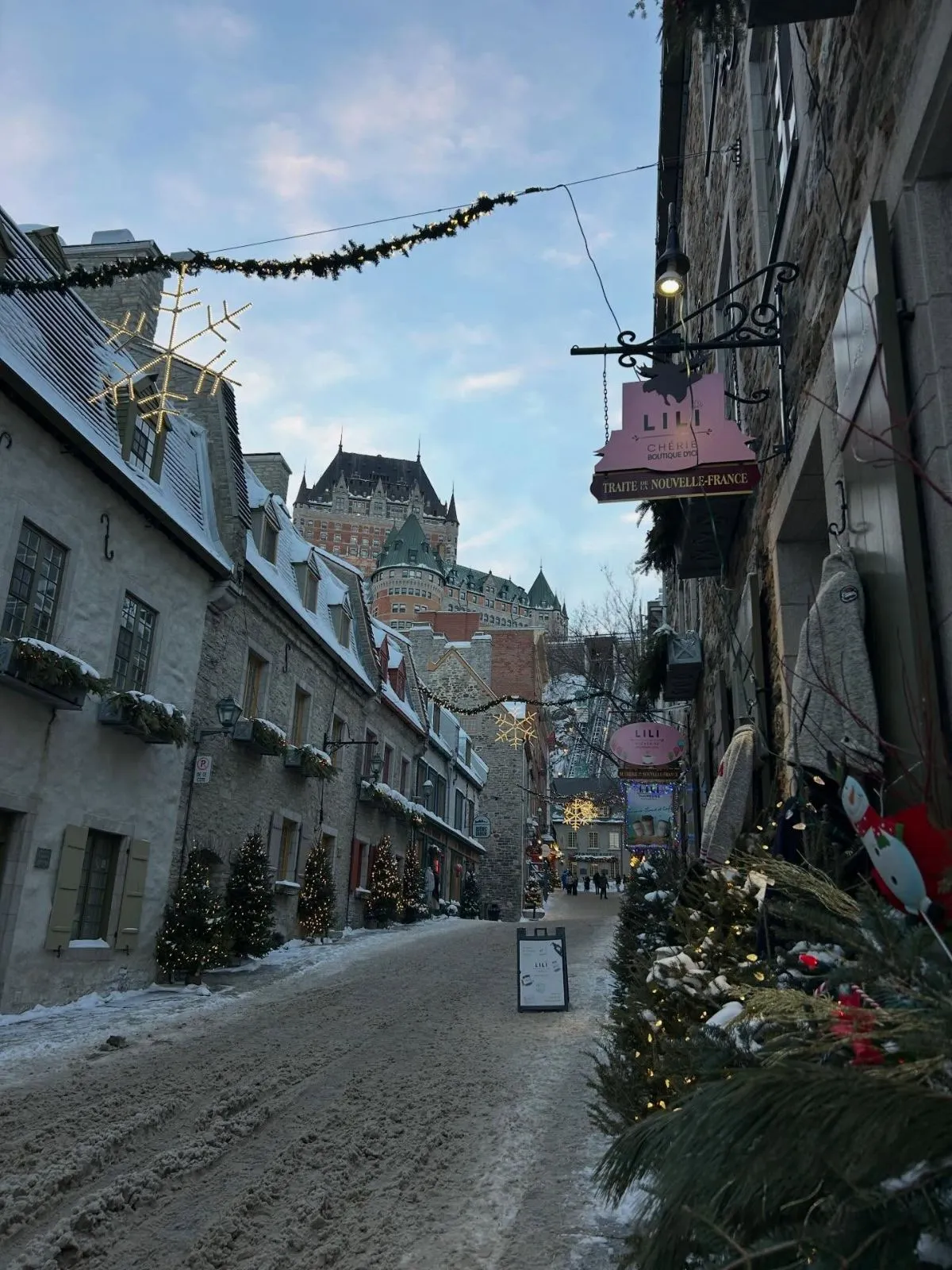 Solo female traveler walking down cobblestone streets in Quebec City