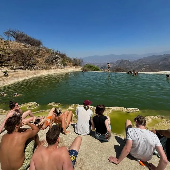 Clear tidal pool reflecting the sky at Playa Agua Blanca