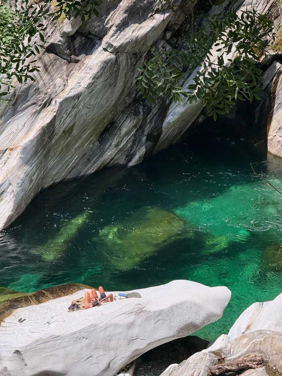 Crystal clear shallow waters of the Aquino river diving site in Switzerland