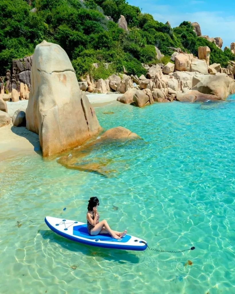 Quiet rocky coastline and shallow waters at Bai Thom beach in Phu Quoc