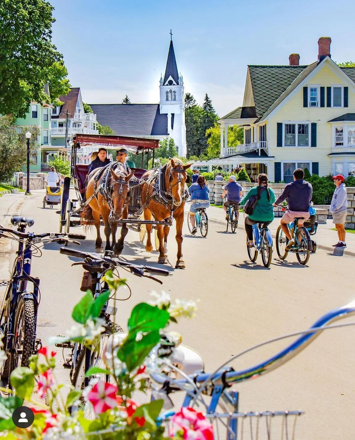 Cyclists riding along the car-free M-185 highway on Mackinac Island