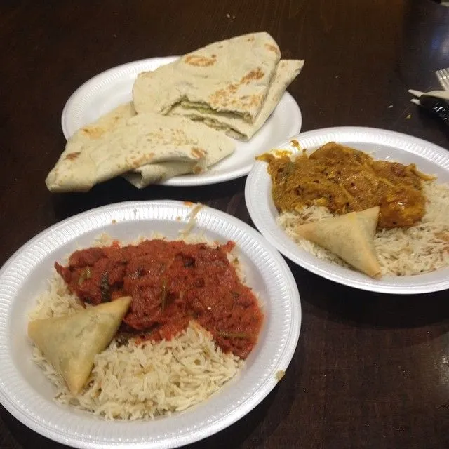 Large portion of affordable authentic curry and rice on a plate