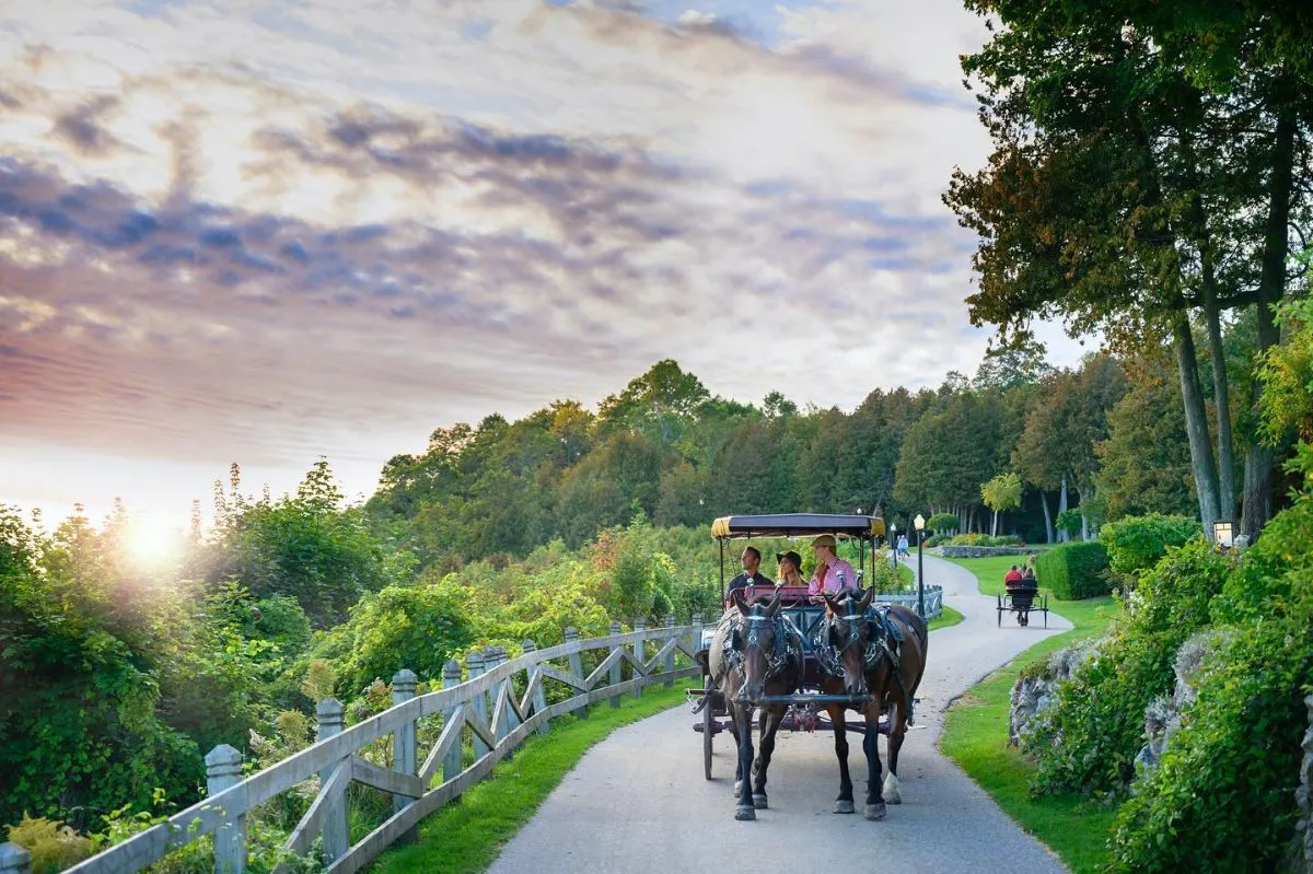 A horse-drawn carriage on a car-free street in Mackinac Island