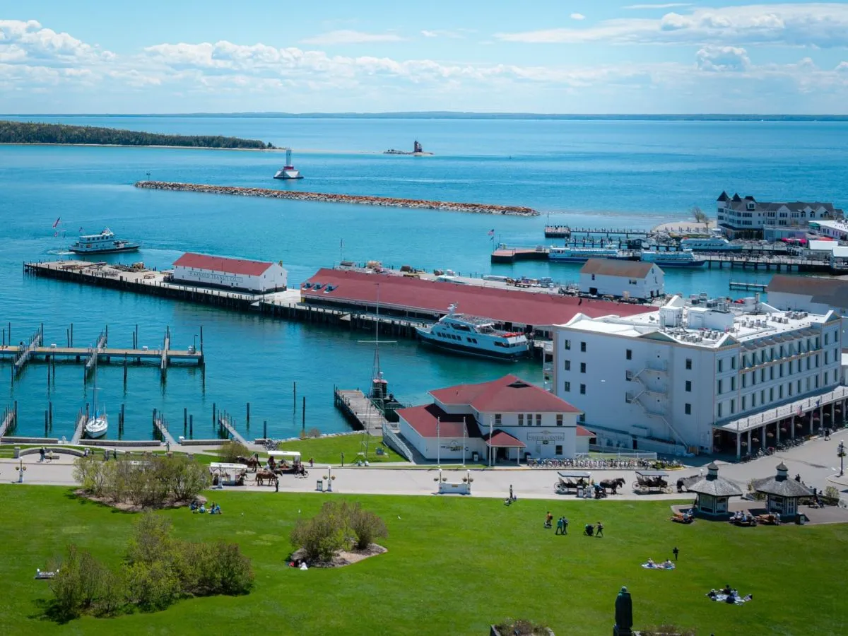 The white stone walls of Fort Mackinac on a cliff with Lake Huron in the background