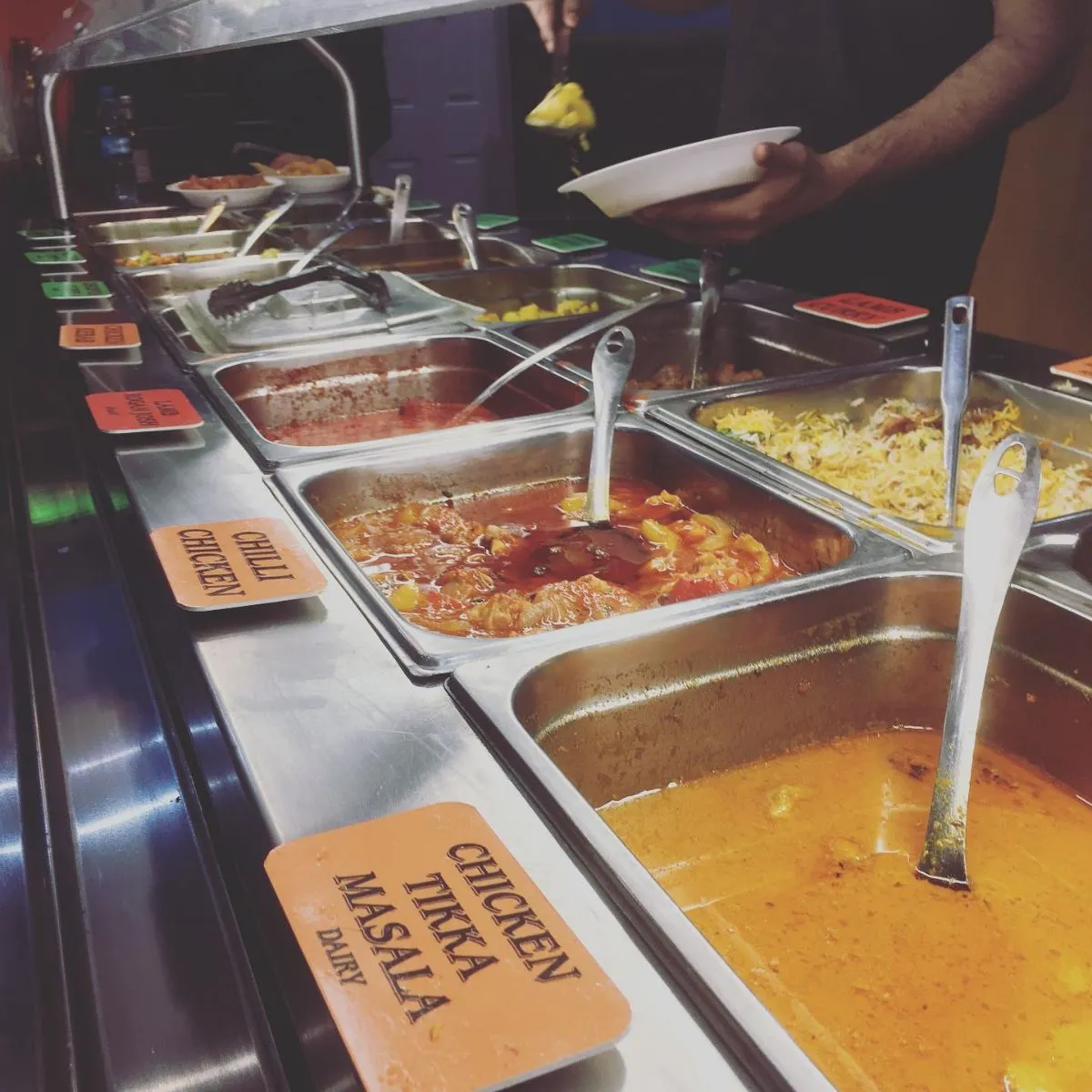 Steaming bowls of authentic curry outside the Mosque Kitchen in Edinburgh