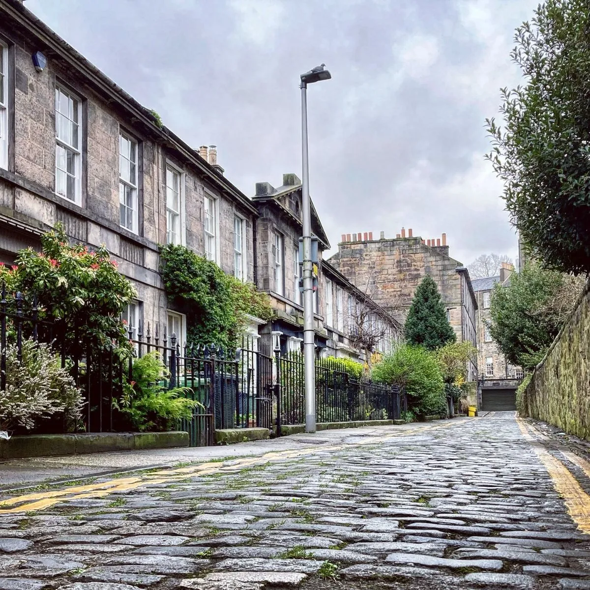 Quiet pedestrian path next to the Water of Leith in Stockbridge