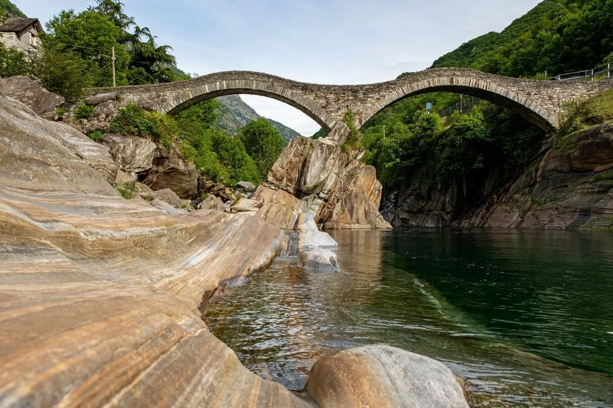 Ponte dei Salti stone bridge over emerald waters in Verzasca Valley