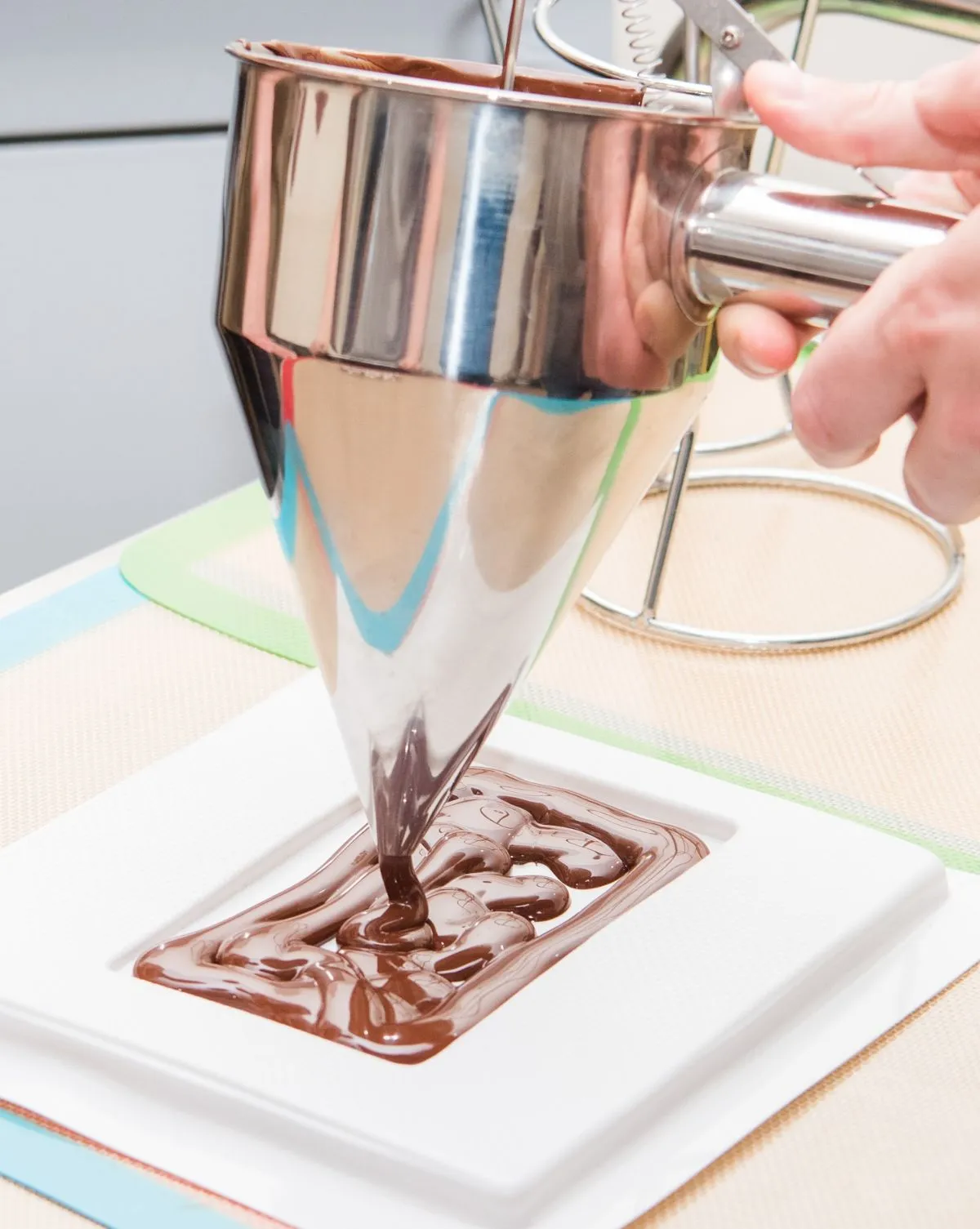 Pouring liquid chocolate into a mold at the Edinburgh Chocolatarium
